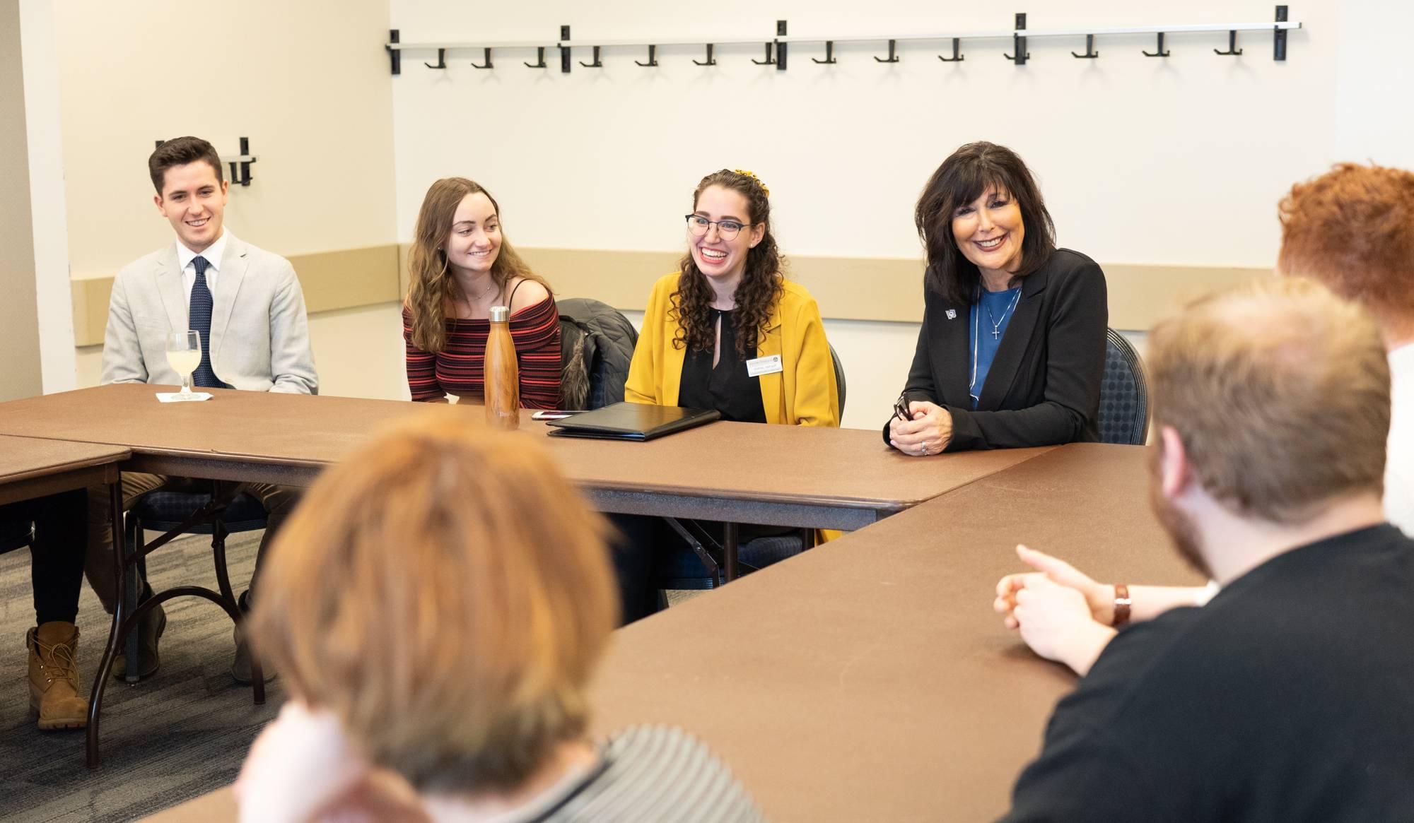 President Mantella talking to student Senate